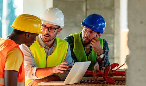Team reviewing inspection documentation on site