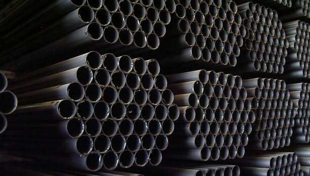 Stacked steel pipes in stock